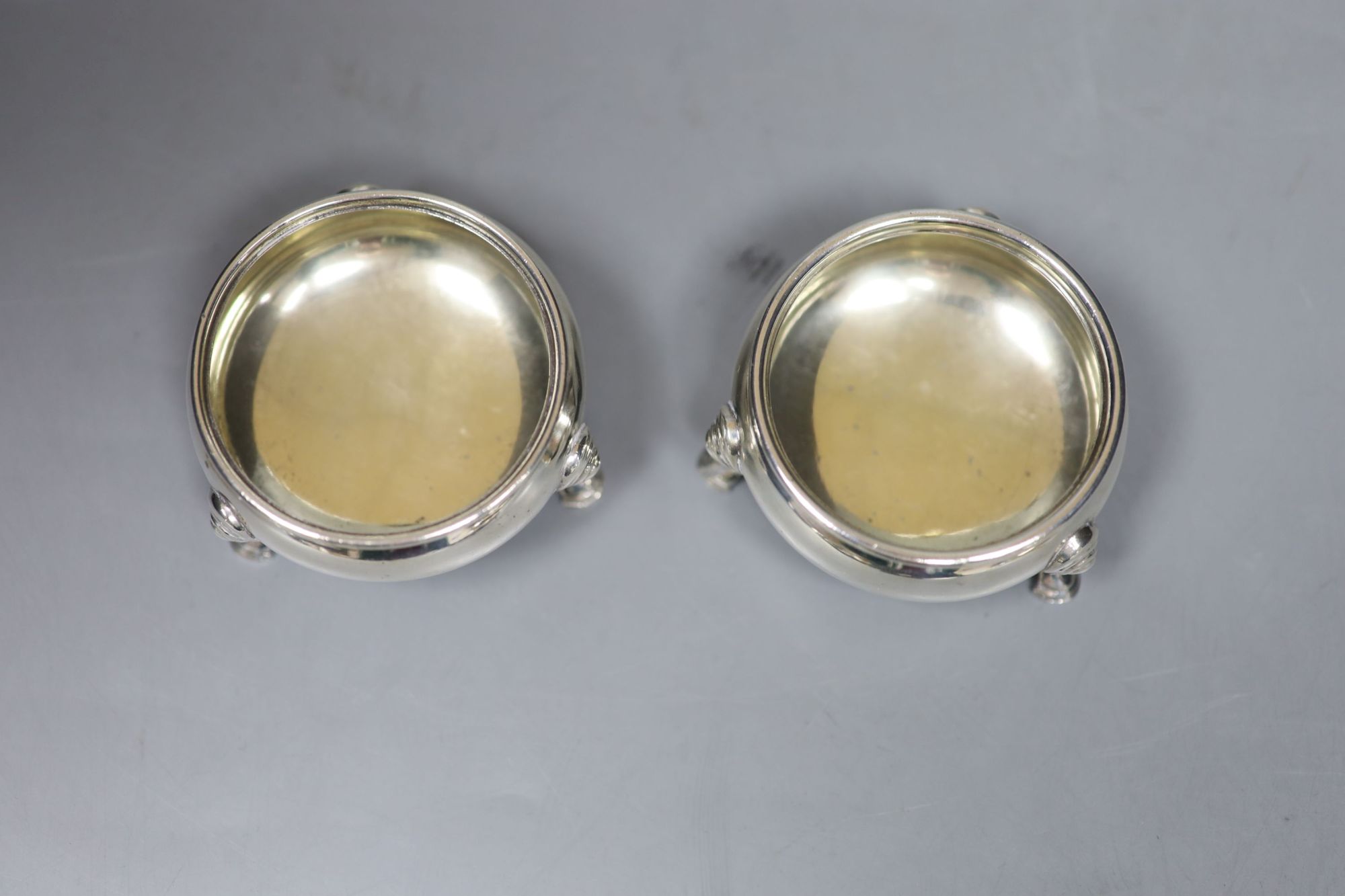 A pair of George V silver bun salts, William Comyns & Sons Ltd, London, 1932/3, diameter 6cm, 4oz.